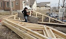 Amanda among the trusses carrying flooring for the scaffolds 