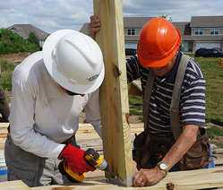 Bill and Dakota crew member working on the frame for the unit's deck