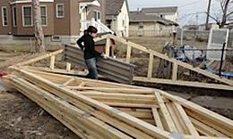 Amanda among the trusses carrying flooring for the scaffolds 