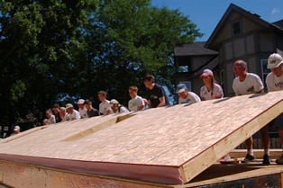 St. Andrew's Church raises wall on two-story St. Paul build