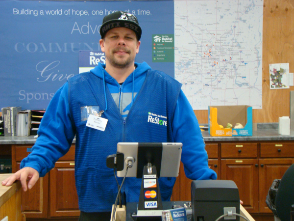 Volunteer Cashier Helps ReStore Run Smoothly