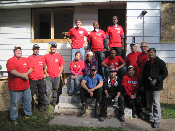 Employees from The Dow Chemical Company volunteer to rehab a home