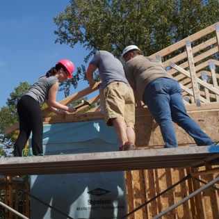 Laughter Rules Among Volunteers on Cargill House Build Site