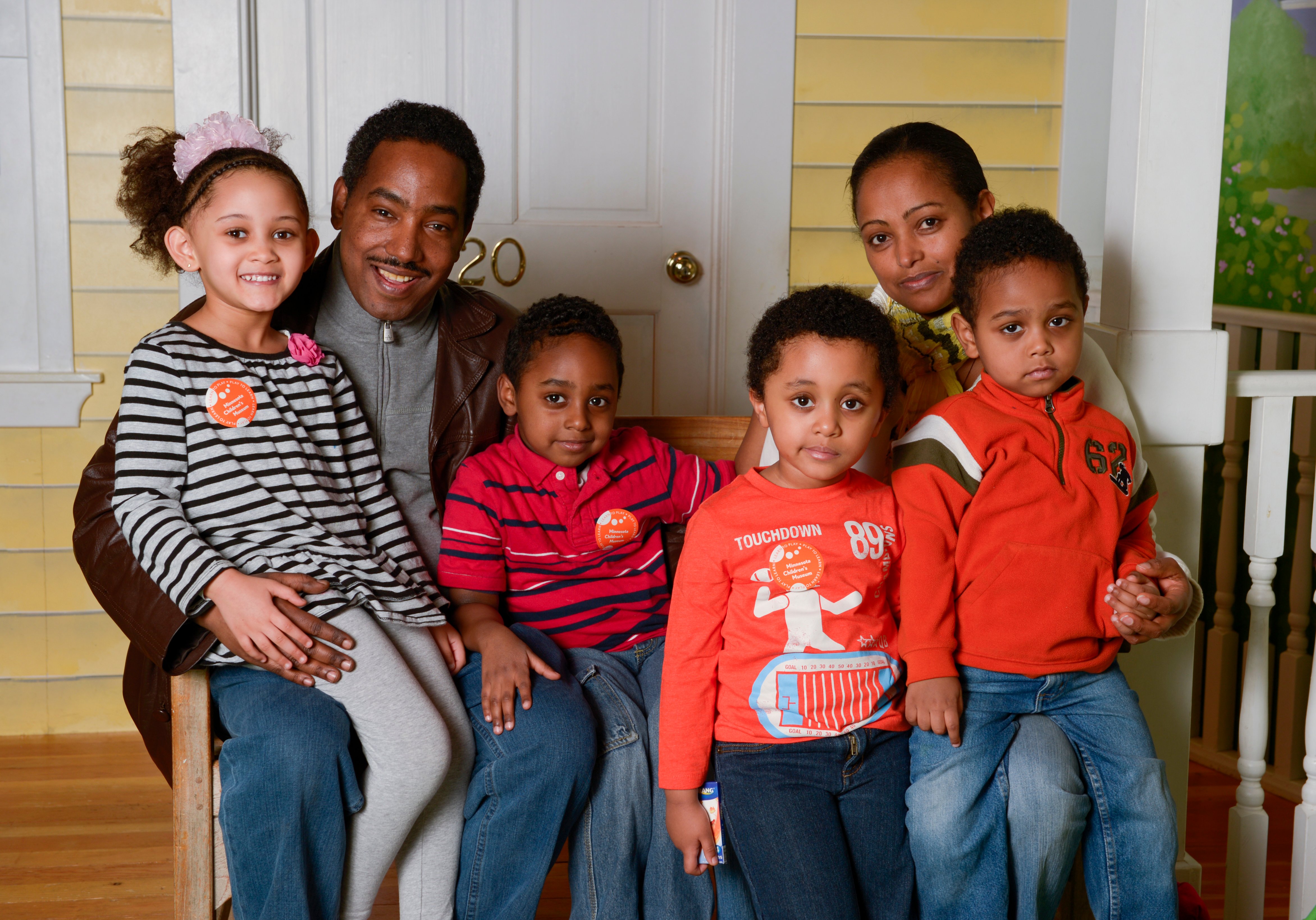 Family in front of their home.