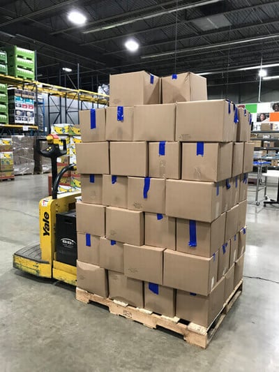 Packed boxes full of food at The Food Group's warehouse.