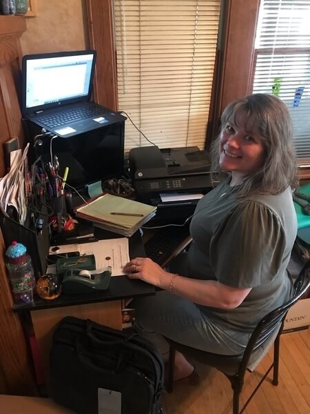 Juanita in her home office.