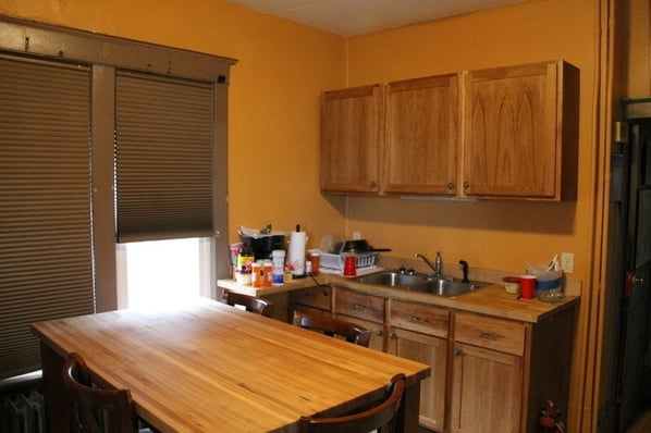 The new counter-height table and cabinets in the kitchen.