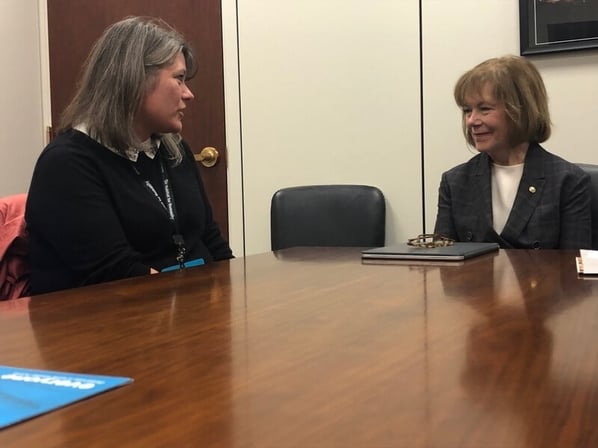 Juanita shares her story with Senator Tina Smith.