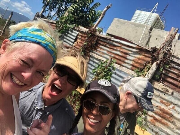 Four volunteers posing in the Dominican Republic.