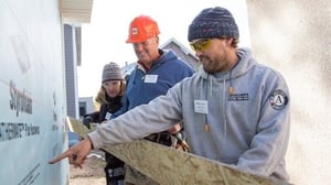 An AmeriCorps member instructing volunteers.