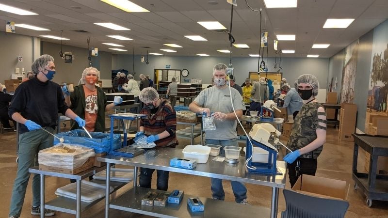 AmeriCorps members working at Feed My Starving Children.