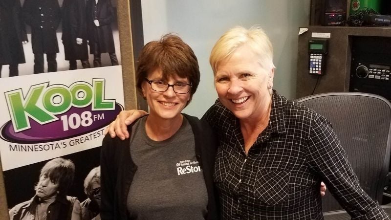 Robin with Lee Valsvik of Kool 108 FM in Lee's office.