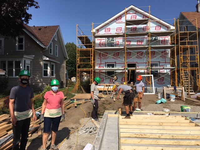  Karen next to her son Chris (left) as more progress is made on the home.