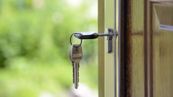 Keys in a front door lock.