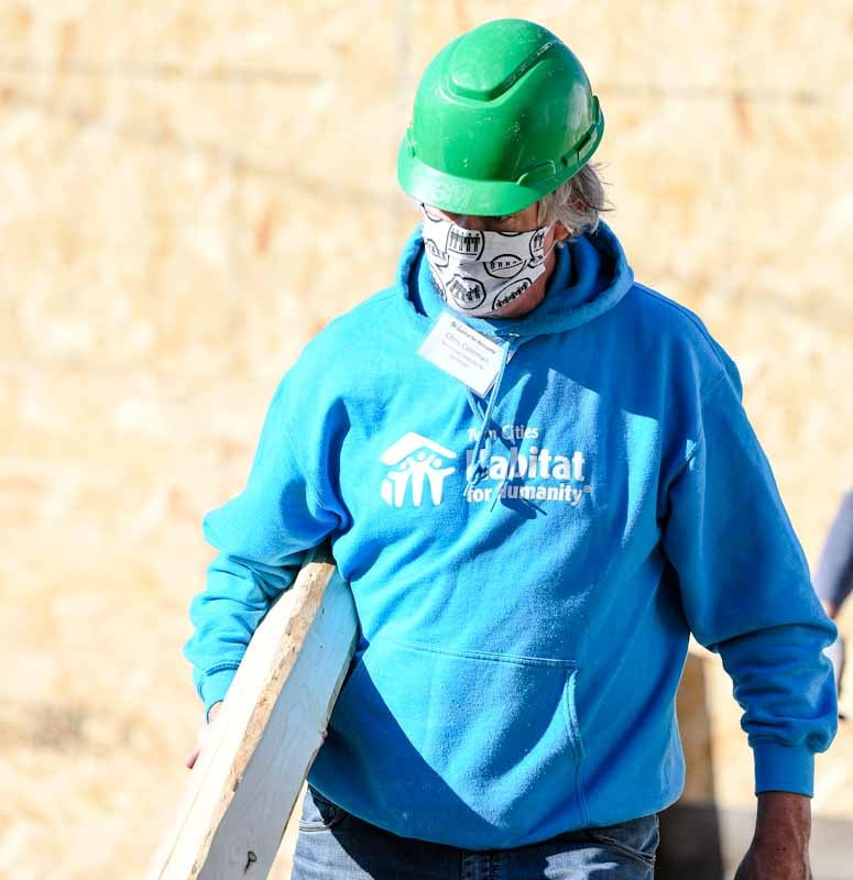 Chris Coleman wearing a mask on a Habitat construction site