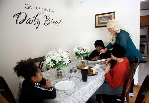 Angel and her family at the dinner table.