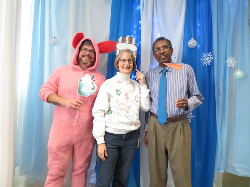 Hassan at the holiday party photo booth