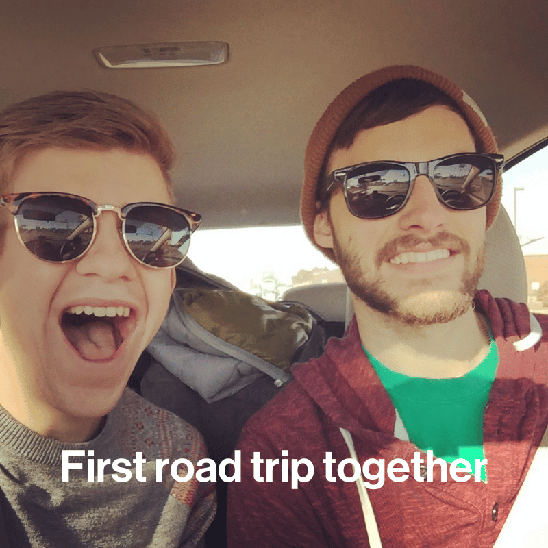 Two men with sunglasses in a car