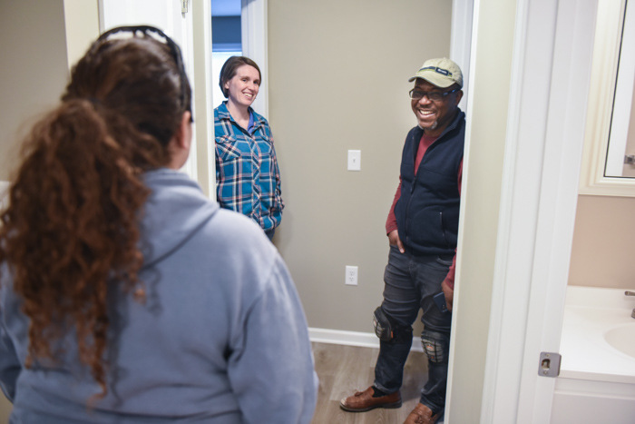 Edgar talking with Habitat staff on site.