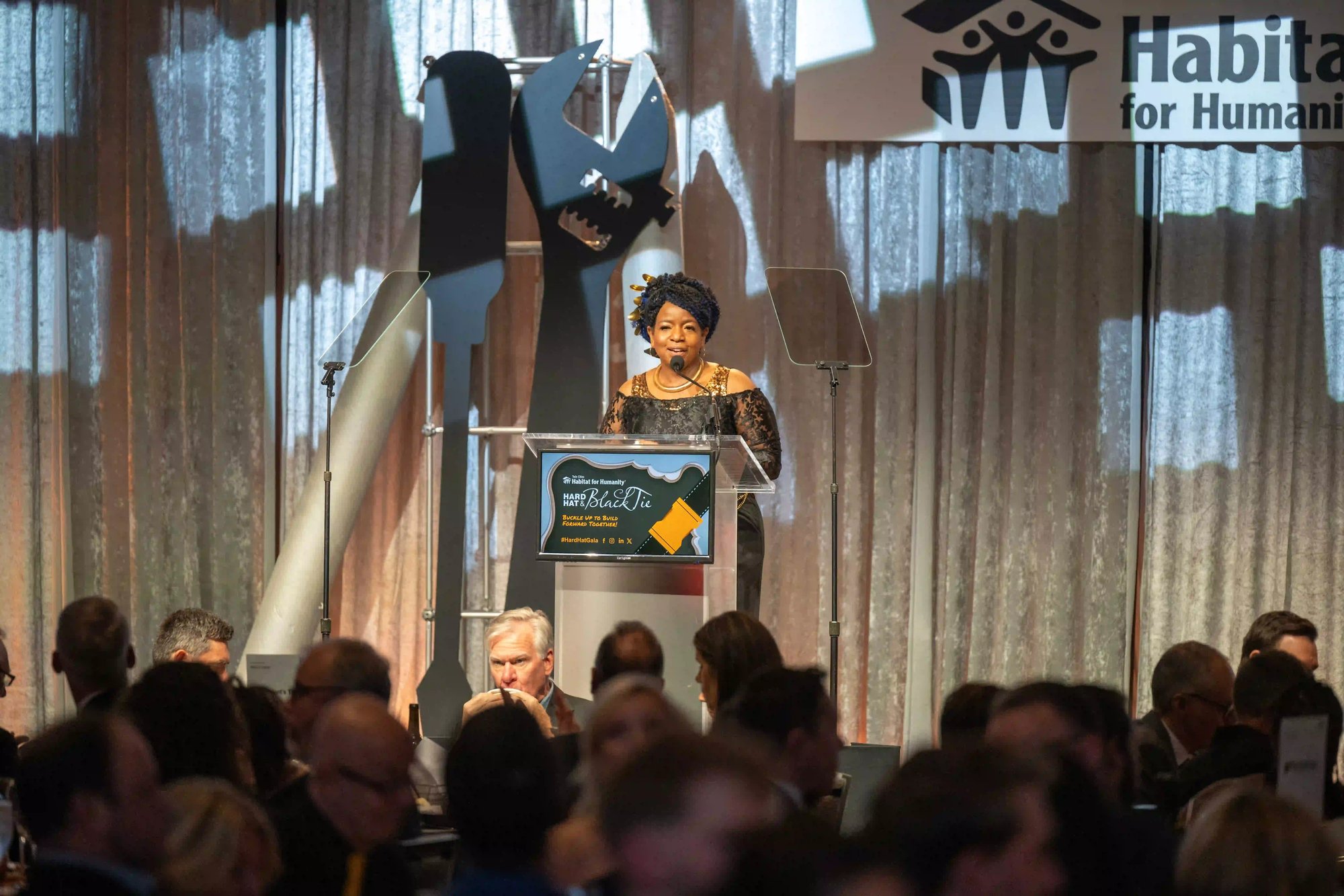 Miss Shannon Paul speaking at a podium.