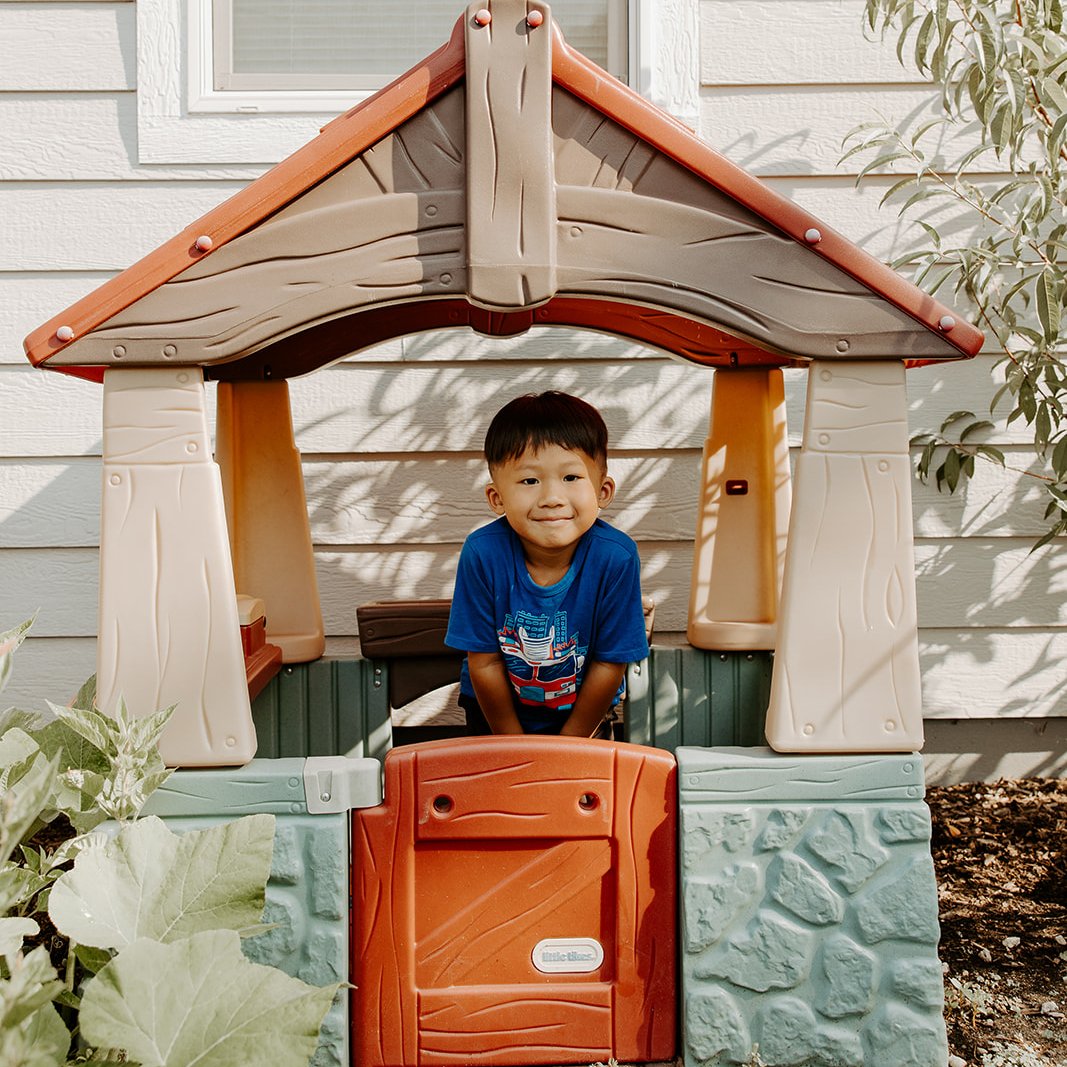 Xue child in playhouse