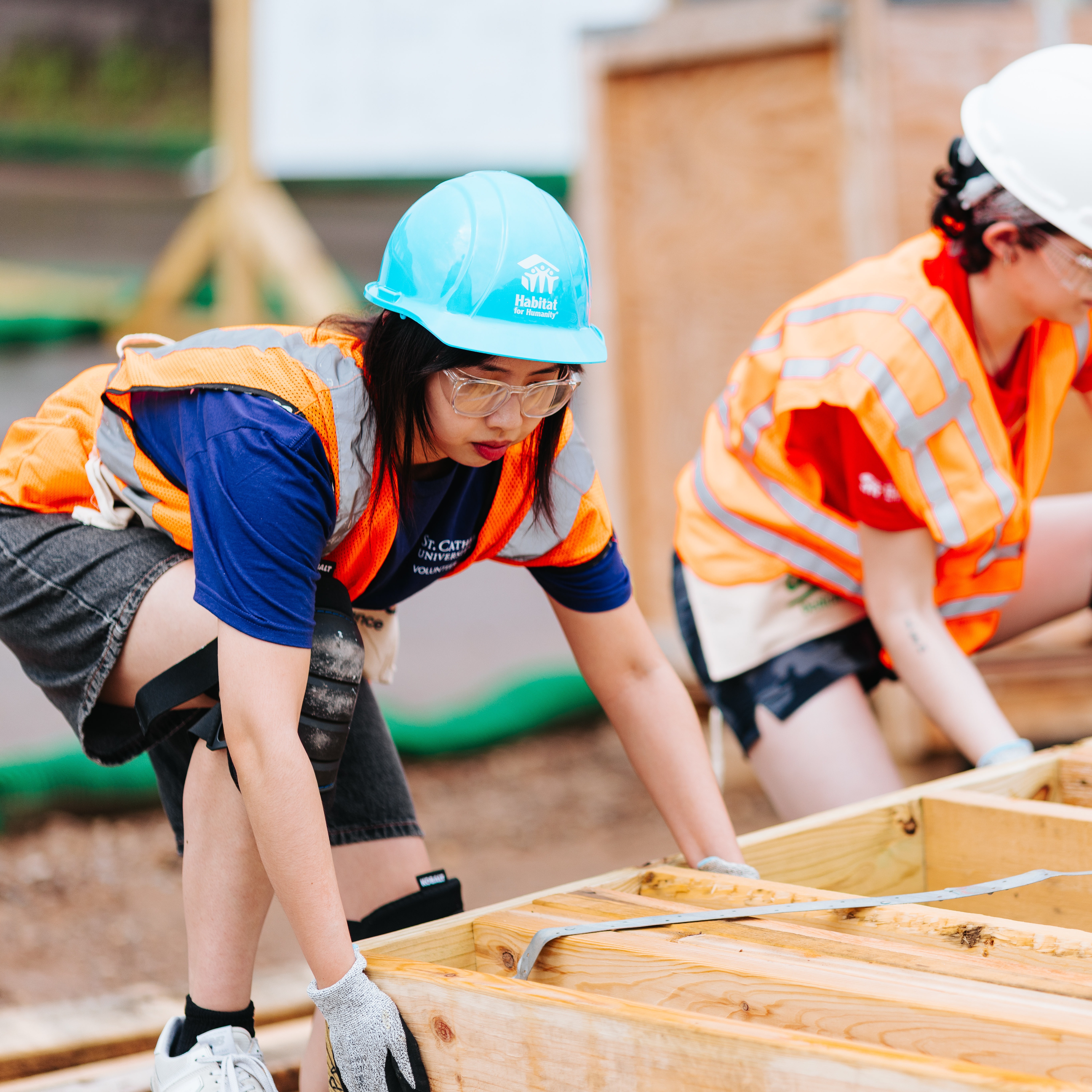Volunteer lifting wall structures.