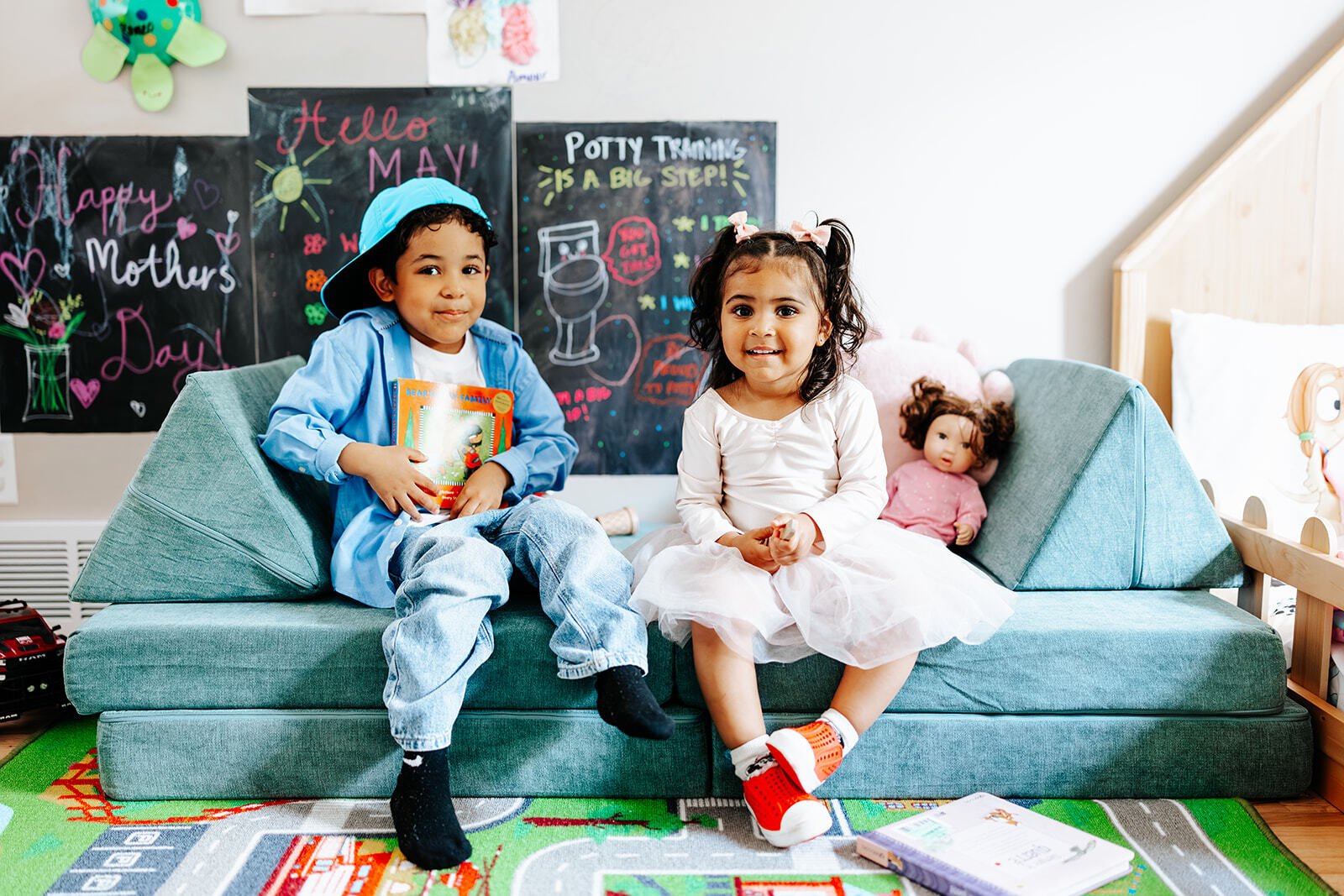Linda's two children on a small couch.