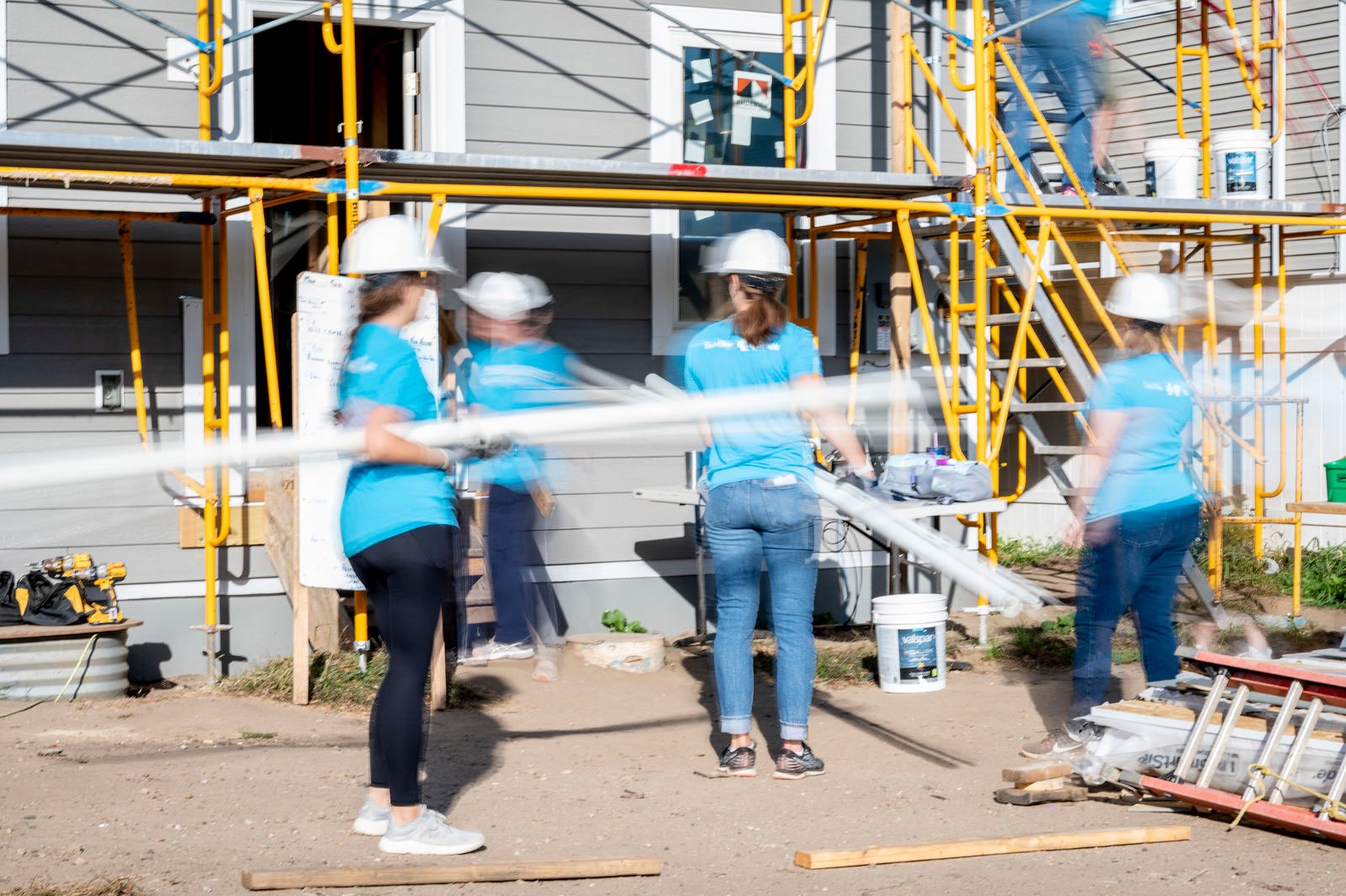 volunteers moving material