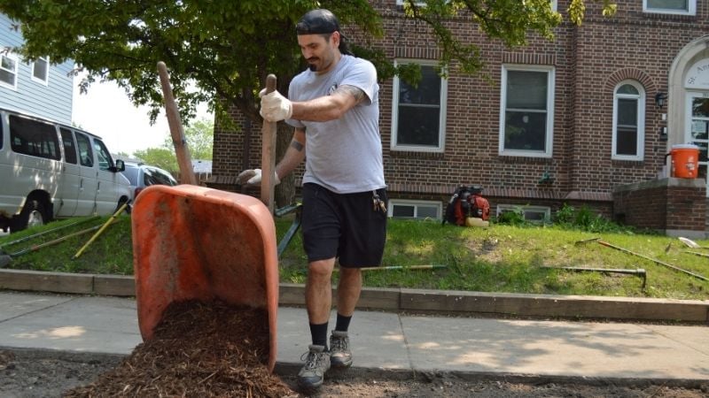 David moving mulch during Jordan Week of Kindness.