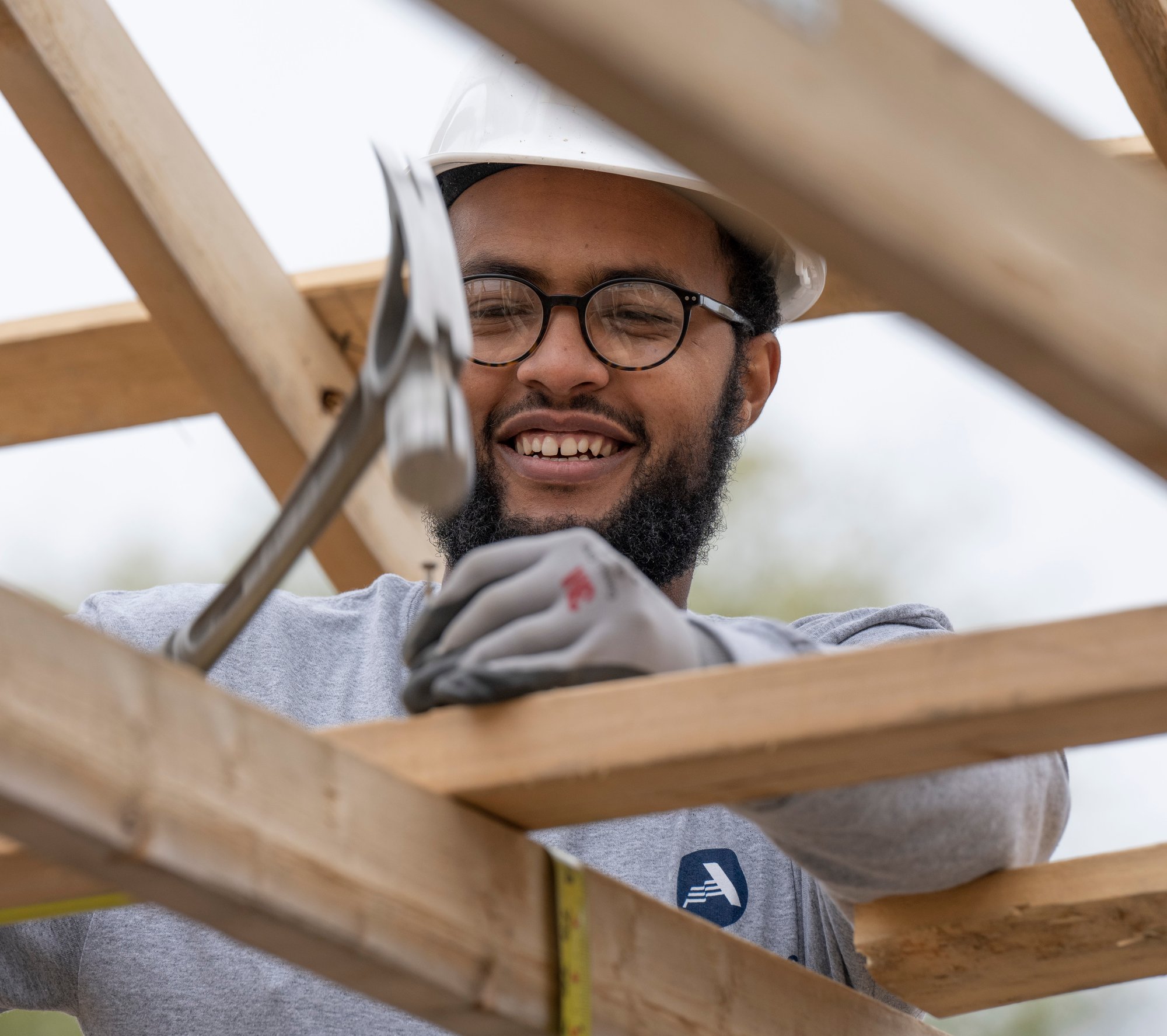 AmeriCorps member working on a house.