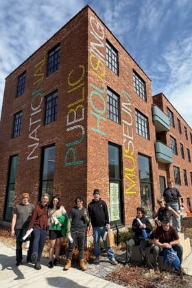 AmeriCorps members outside the National Public Housing Museum.