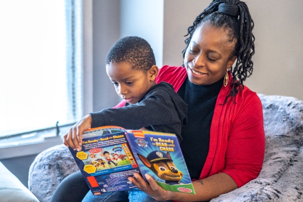 Prince and Arlisa reading a book together.