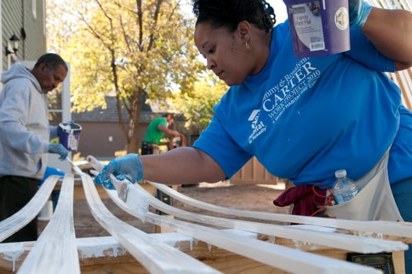 A project volunteer painting.