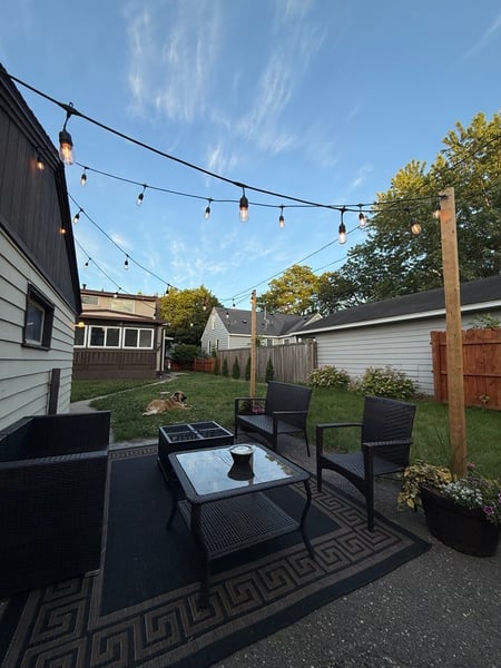 Backyard patio with string lights.