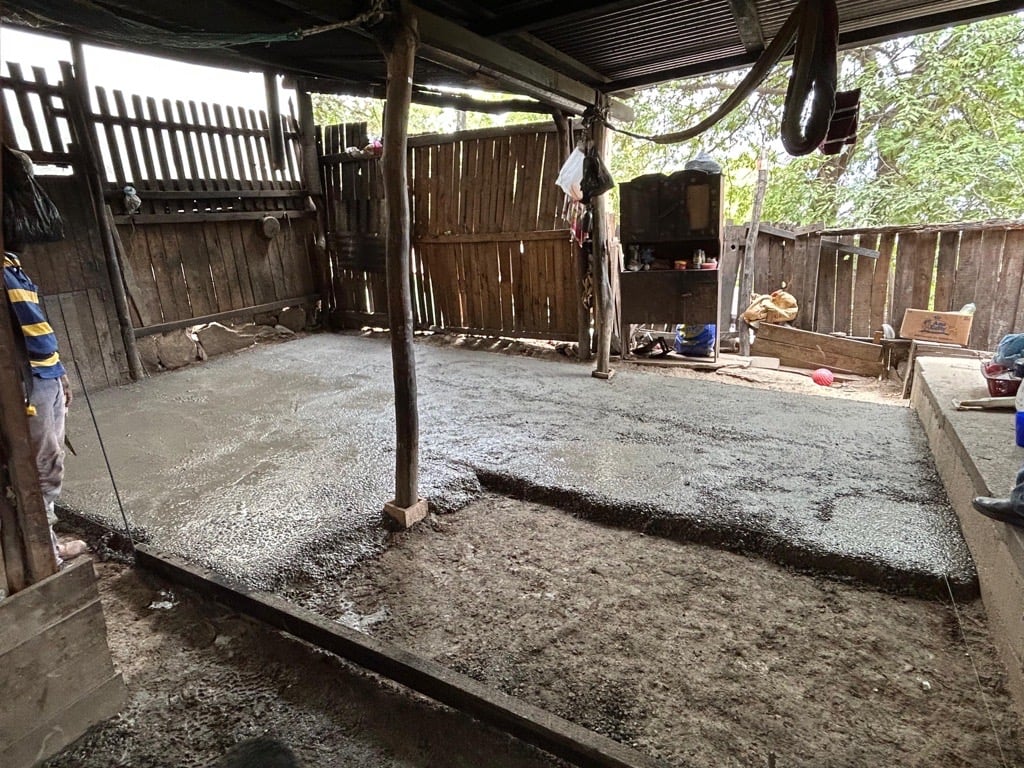Replacing a dirt floor with concrete in Guatemala.