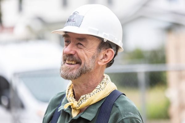 Volunteer smiling.