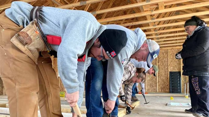 AmeriCorps members working on the home