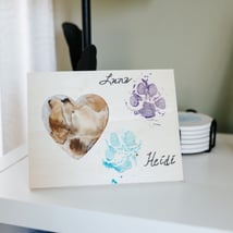 Frame with photo of Anne's dogs.