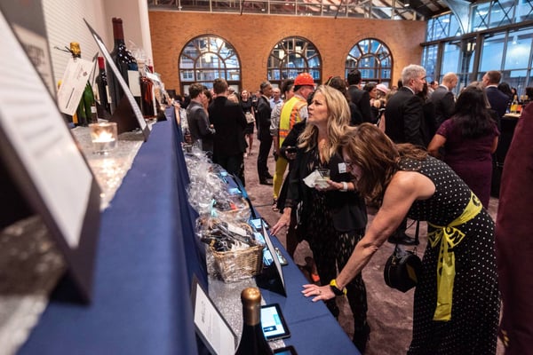 Guests browsing the silent auction.