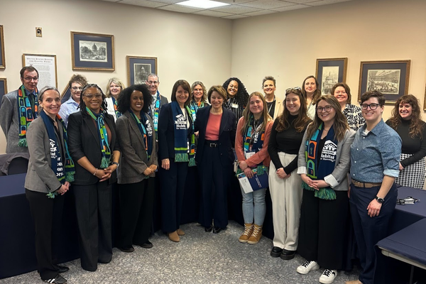 Habitat staff posing with Senator Amy Klobuchar.