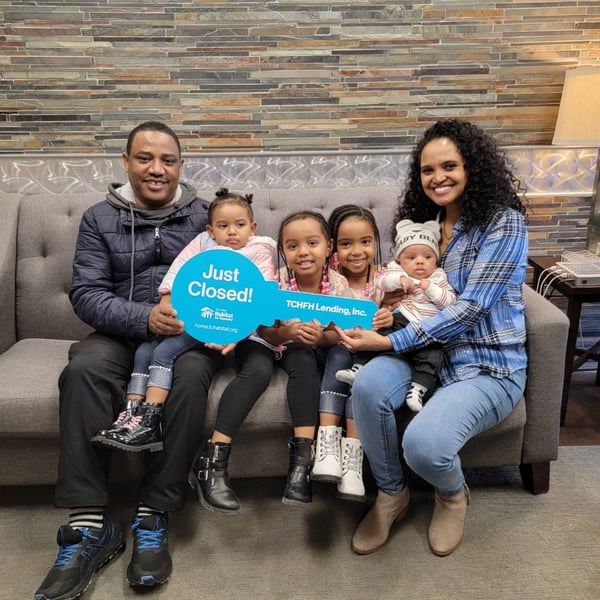 Habitat homebuyer Mengesha and her family at closing.