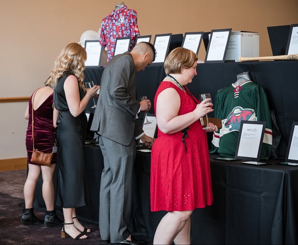 Guests looking at auction items.