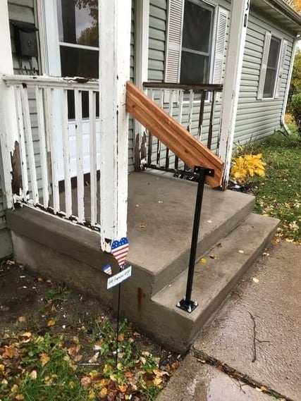 The front steps to Katie's home, complete with new handrails.