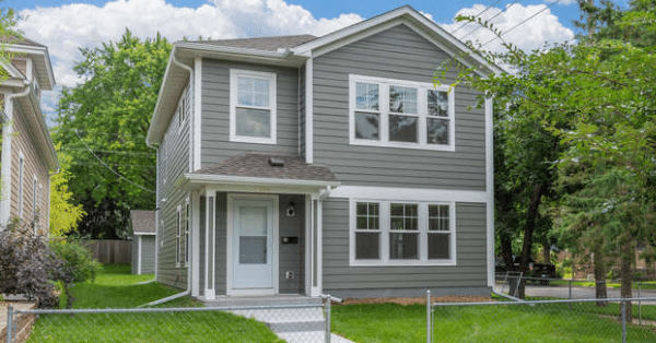 Habitat home on a green yard