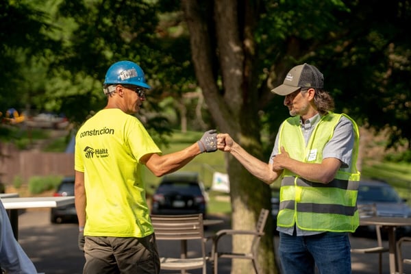 Minnetonka Mills construction crew greet each other.