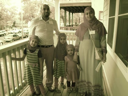 new homeowners Mohamed and Caltu and their family