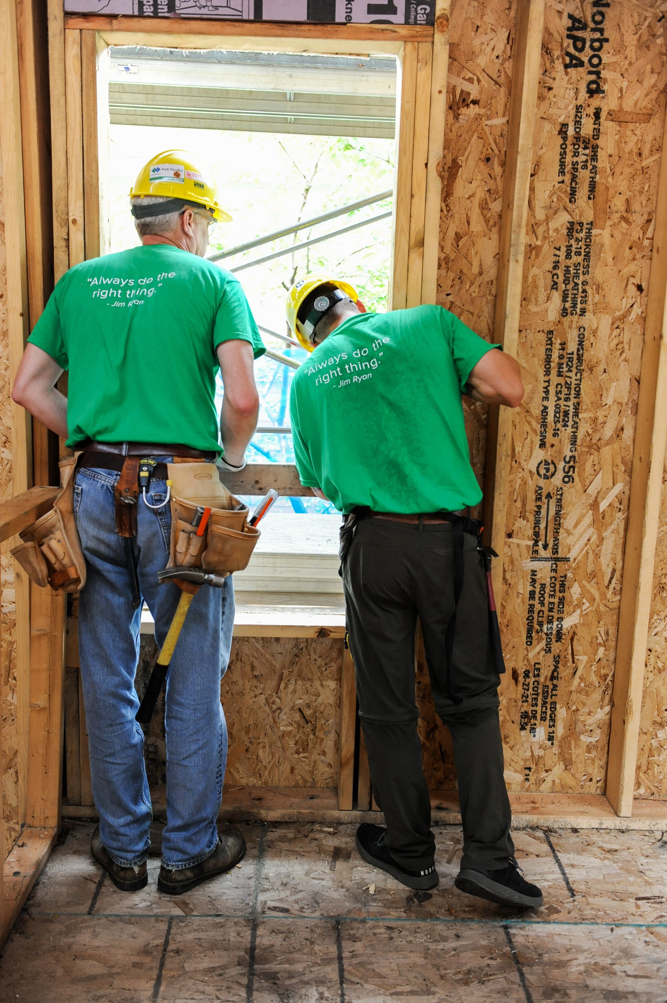 volunteers working on a window