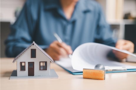 Homeowner looking through papers.