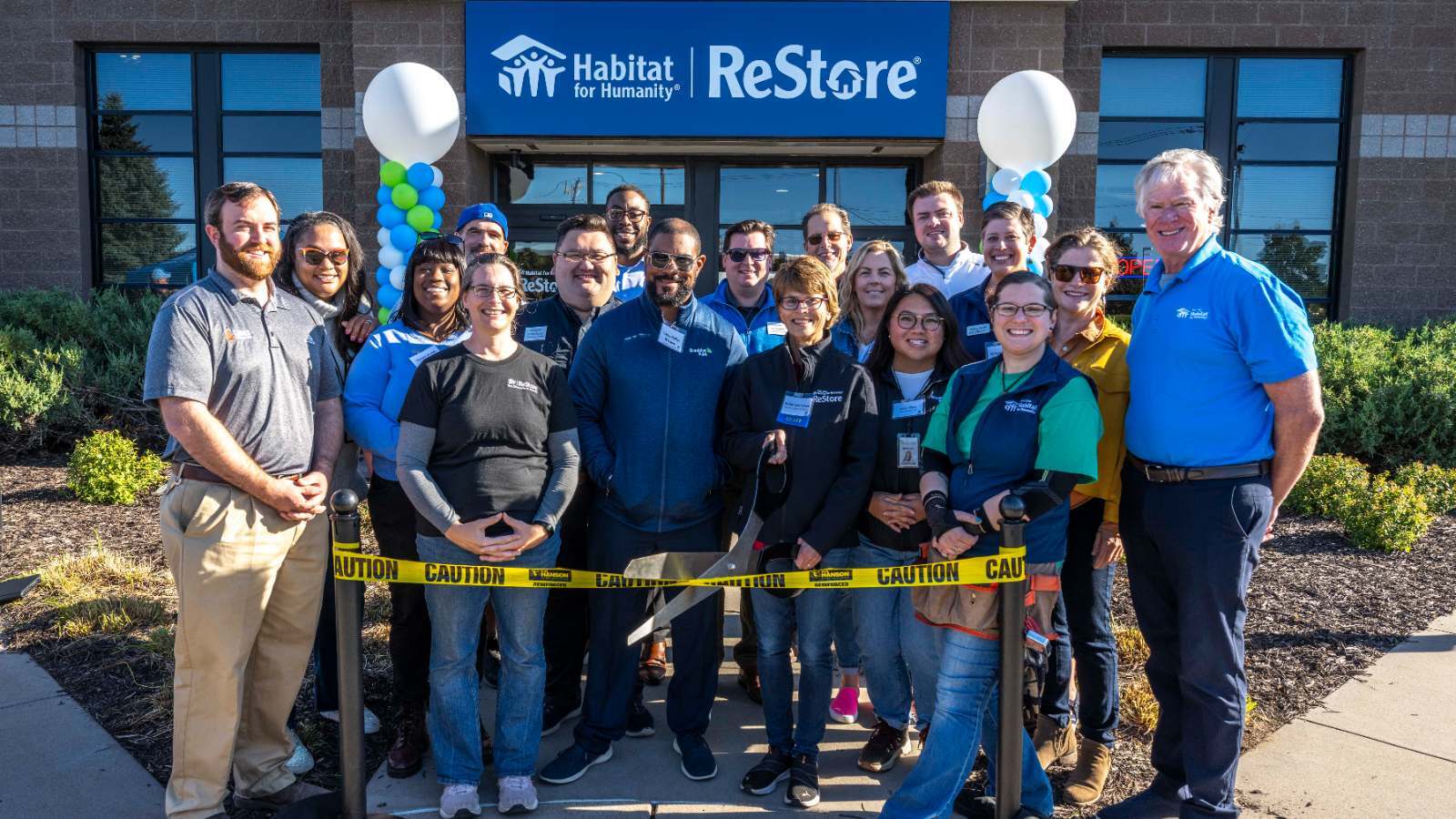 ReStore Grand Opening ribbon cutting group 1600x900