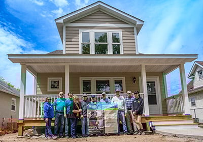 group in front of house